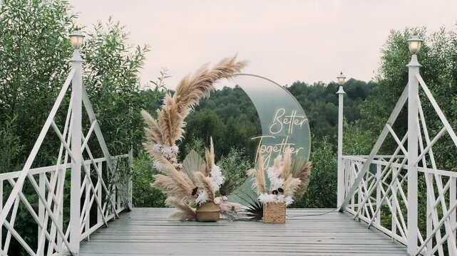 a registration arch against the backdrop of a green summer forest