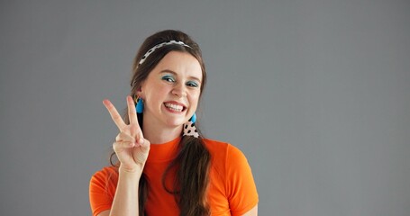 Portrait, smile and woman with peace sign for fashion on gray background mockup space with retro...