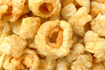 Closeup of pork snack or pork rinds, deep fried pork skin and blistered is traditional food in the north of Thailand.