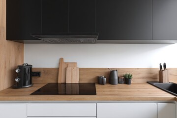 Modern kitchen interior featuring sleek appliances, wooden countertops, and minimalistic decor