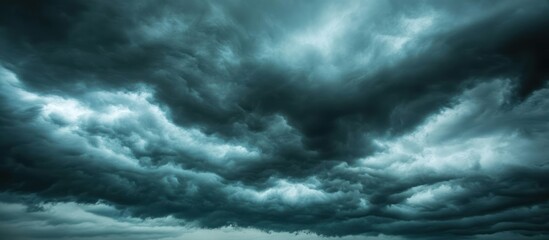 Ominous sky filled with dark storm clouds hinting at impending weather event