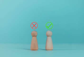 Wooden blocks showing right and wrong signs, decisions, votes and yes or no. Business options for...