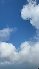 Stunning Cumulus Cloudscape: A Breathtaking View of White Fluffy Clouds Against a Vivid Blue Sky