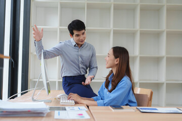 Business people working and brainstorming together in modern office