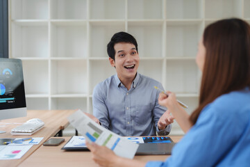 Enthusiastic business meeting with data analysis