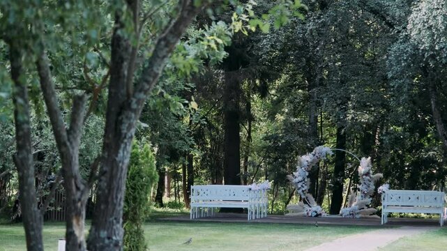 a registration arch against the backdrop of a green summer forest