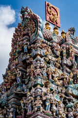 Colorful gopuram of sri mariamman temple showing deities and ornate decorations in singapore