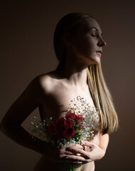Young woman with bouquet of flowers.
