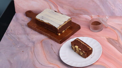 Kaasstengels or often called Cheese Shortbread in the photo with a wooden coaster and white plate....