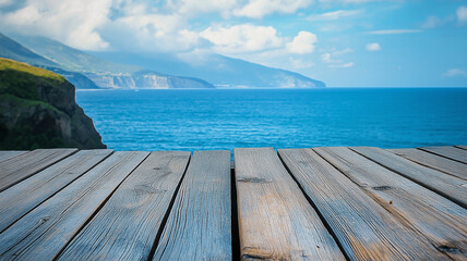 Fototapeta premium Weathered wooden planks overlooking a blurred ocean horizon