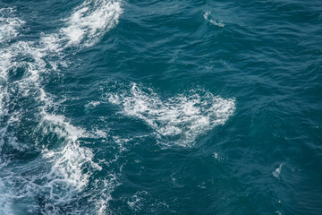 Beautiful Tranquil Ocean Waves Creating Dynamic Patterns on Blue Water Surface