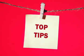 Business and Top tips concept, copy space. Top tips symbol. Concept words Top tips on a yellow...