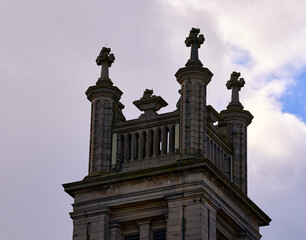 The majestic towers of Edinburgh stand tall against the spring sky, showcasing Scotland's rich architectural heritage and timeless beauty.
