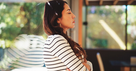 Stress, arms crossed and woman by window with reflection or depression in home. Thinking, anxiety...