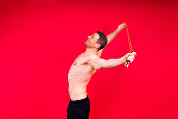 Portrait, happy man and bodybuilder with abs on studio background, backdrop and topless pride