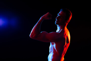 Portrait, happy man and bodybuilder with abs on studio background, backdrop and topless pride
