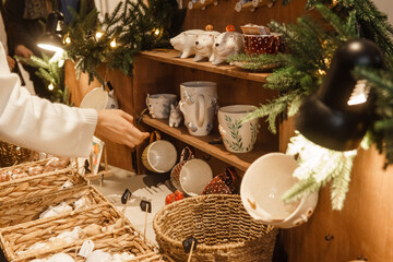 Sale of handmade ceramic Christmas tree toys at the Christmas Fair. Black Friday for the winter...