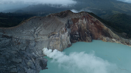 aerial view of the interior of a volcano crater, with a lake of sulphur. Java, Indonesia - 19th March 2025