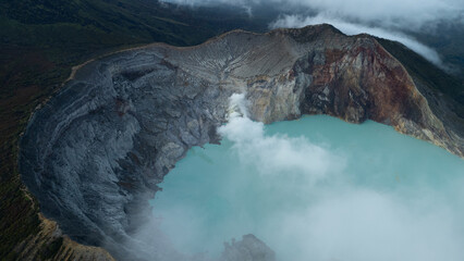 aerial view of the interior of a volcano crater, with a lake of sulphur. Java, Indonesia - 19th March 2025