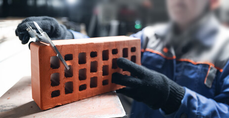 Quality control testing and measuring bricks for construction standards on industry factory