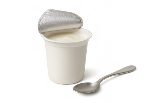 White yogurt cup with opened foil lid and spoon on transparent background