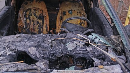  Burnt Electric Car Wreck with Melted Interior and Tires Caused by Battery Fire