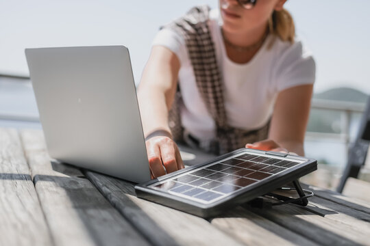 digital nomad woman working remotely from a cozy kitchen during breakfast. Remote work, sustainability, wellness, Gen Z, conscious living, home office and online freelancing