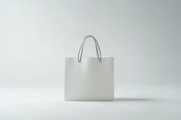 Blank white shopping bag against a plain white background
