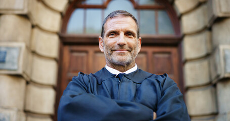 Portrait, man and judge with confidence in city for career pride, urban justice and court recess....