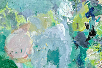 Artist's palette. Photo of a palette consisting of blue, green and yellow paints. Creative abstract background, backdrop.