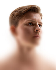 Creative artwork. Close-up of serious young man in soft light, face surrounded by white blur and clear eyes focus. Portrait shows discipline and depth. Concept of masculinity, reflection, power.