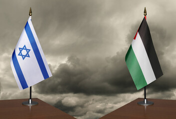 Table flags Israe and Palestine a stormy sky in the background