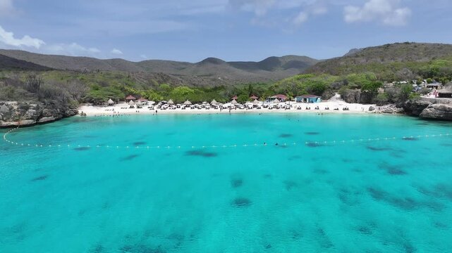 Kenepa Grandi Beach In Willemstad Netherlands Curacao. Turquoise Ocean Waves Gently Crashing On Tropical Beach. Shore Clouds Sky Beach Sea. Shore Seaside Tropical Environment. Willemstad Netherlands.