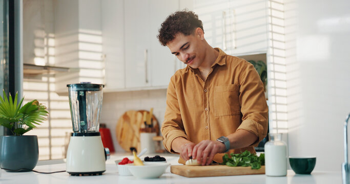 Man, smoothie and cut vegetables in kitchen for breakfast shake, meal replacement and diet nutrition. Blender, person and ingredients preparation in home for healthy recipe, fresh fruit and wellness