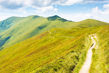 mountain landscape with path uphill. scenic view. beautiful nature scenery with steep grassy slopes...