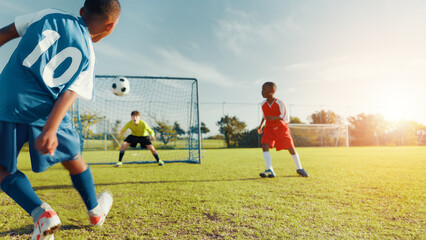 Sports field, soccer player and children with ball, goal and athlete with energy for practice in...
