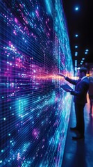 A businessman interacts with a large, vibrant digital display wall showing streams of data in blue and purple hues, possibly a server room or data center