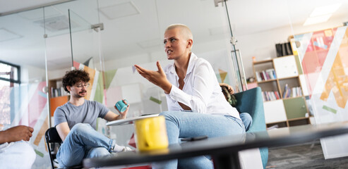 In a student support center at the creative office, two students of varied backgrounds gather to advance causes like human rights and race equality.	
