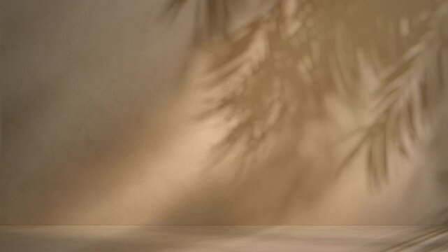 4K Seamless loop of tropical leaf shadows on warm beige wall, soft natural light animation with copy space, botanical overlay for visual design, ambient video backgrounds, and product presentation