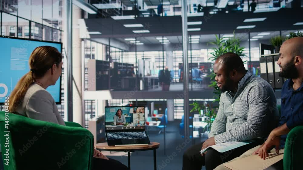 Poster multiethnic business leaders engaged in a web video conference in office lobby, exchanging strategy 