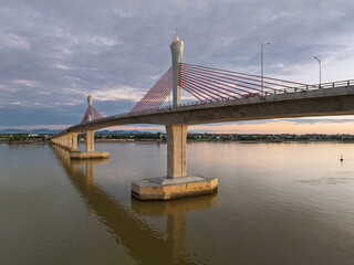 Cua Hoi bridge spans tranquil waters in Vinh city, showcasing modern engineering in Nghe An province, Vietnam
