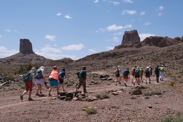 Amazing mountain landscapes of Jebel Saghro with volcanic rocks eroded by wind and time and group of trekking tourists. Atlas, Anti Atlas, Morocco © Iwona