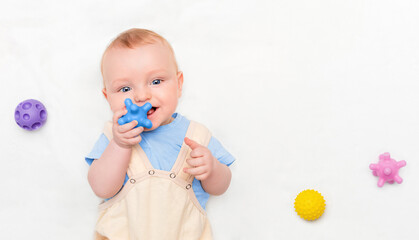 baby playing with tactile balls, top view