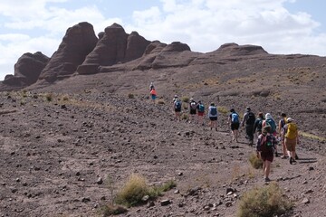 Amazing mountain landscapes of Jebel Saghro with volcanic rocks eroded by wind and time and group...
