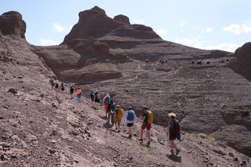 Amazing mountain landscapes of Jebel Saghro with volcanic rocks eroded by wind and time and group...