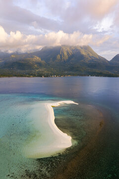 Aerial view of white island sandbar and Camiguin at sunset, Philippines