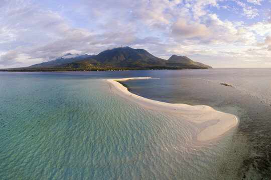 Aerial view of white island sandbar and Camiguin at sunset, Philippines