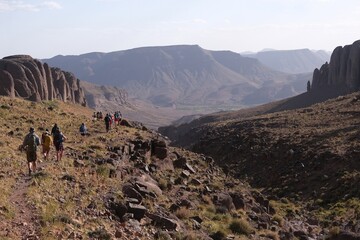Amazing mountain landscapes of Jebel Saghro with volcanic rocks eroded by wind and time and group...