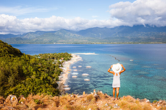 Woman on hill overlooking the island, Panay, Philippines
