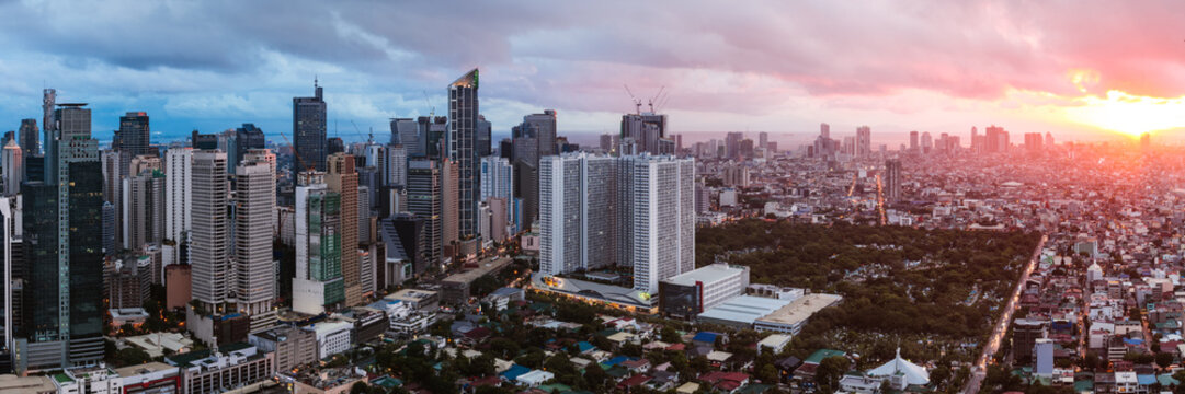 Panoramic view of Makati urban skyline at sunset, Manila, Philippines